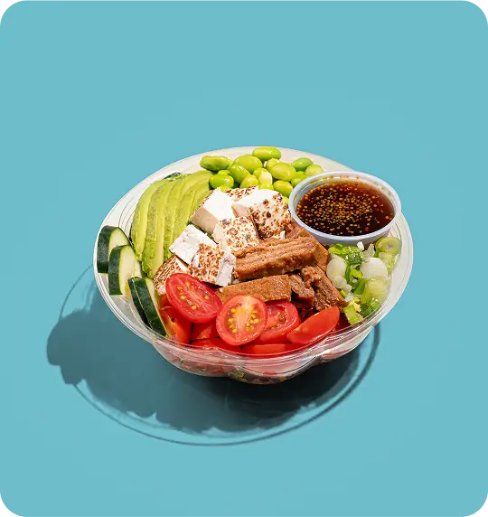 Vegan poke bowl with inari tofu, avocado, edamame, tomatoes, and ponzu sauce, New Jersey restaurant.