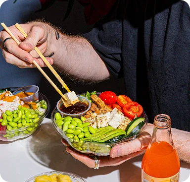 Vegan poke bowl with tofu, edamame, cherry tomatoes, cucumber
