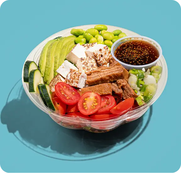 Vegan poke bowl with seared tofu, avocado, edamame and sauce